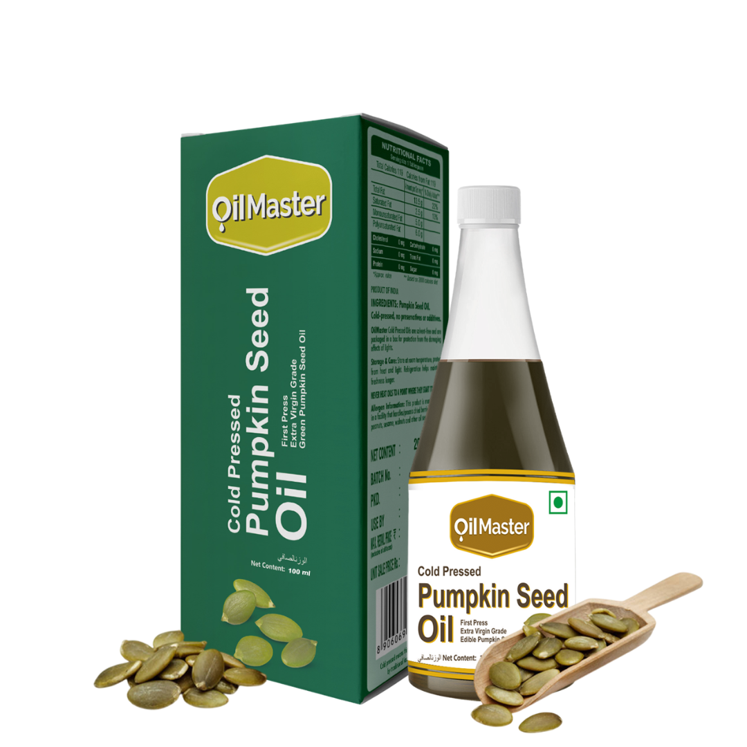 OilMaster cold pressed pumpkin seed oil bottle and packaging with pumpkin seeds on a white background